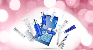 Collection of skincare products on a pink background with blurred lights